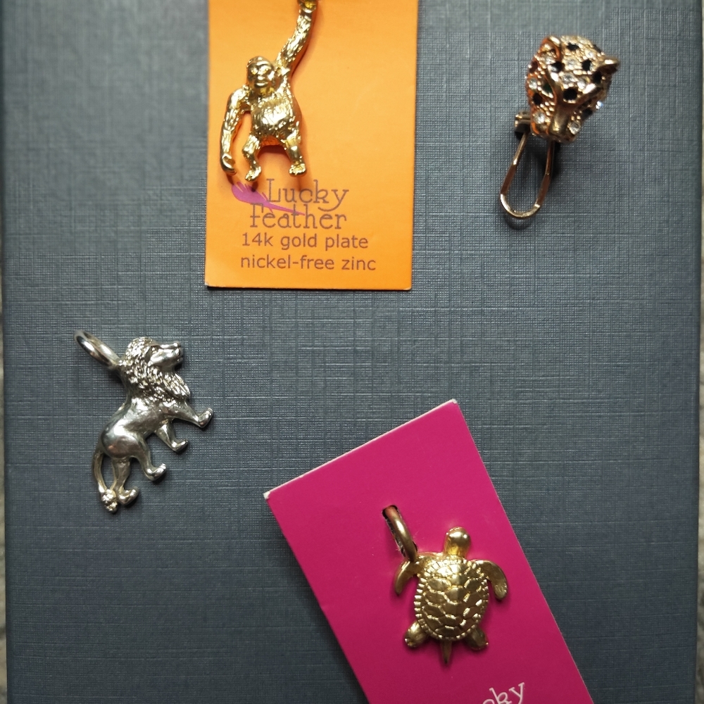3 animal pendants with a single earring